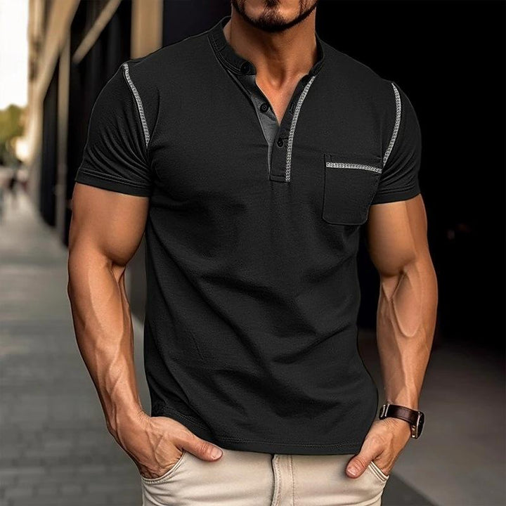 Man models a stylish slim-fit henley t-shirt. Casual short-sleeve top for comfortable summer men's fashion.