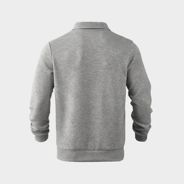 Close-up of the textured design on a men's half-zip pullover, casual knit fabric detail