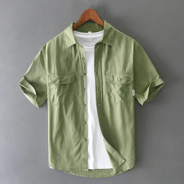 Versatile gray men's short sleeve shirt for casual workwear and relaxed everyday outfits. Comfortable button-up.