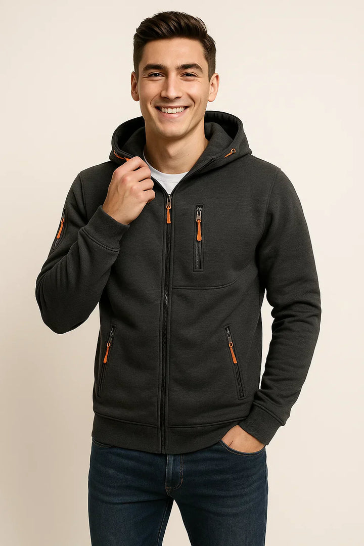 Side view of a man effortlessly wearing a black zip-front hoodie, highlighting the casual fit and versatility.