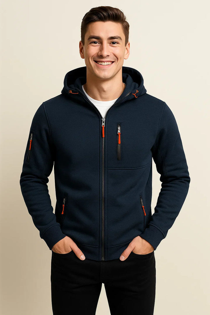 Model wearing a men's zip front hoodie in an outdoor setting, demonstrating its outerwear appeal.