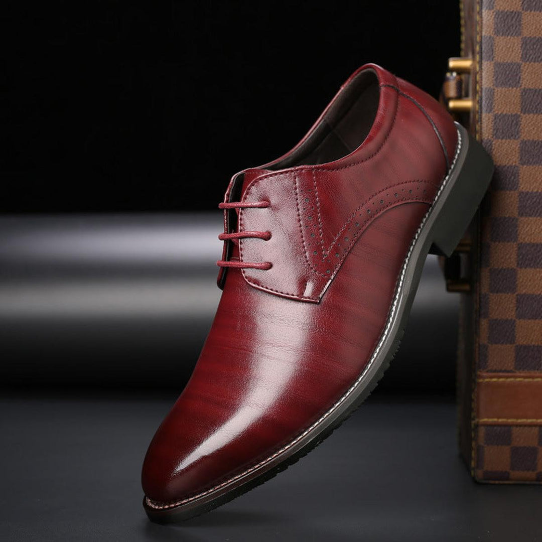 Close-up of men's formal lace-up shoes, showcasing the polished leather and classic design style.