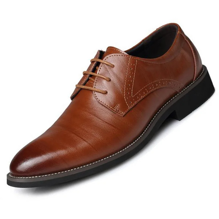 Detailed view of men's brown leather Oxford dress shoes, featuring a durable lace-up design for comfort & formal events.