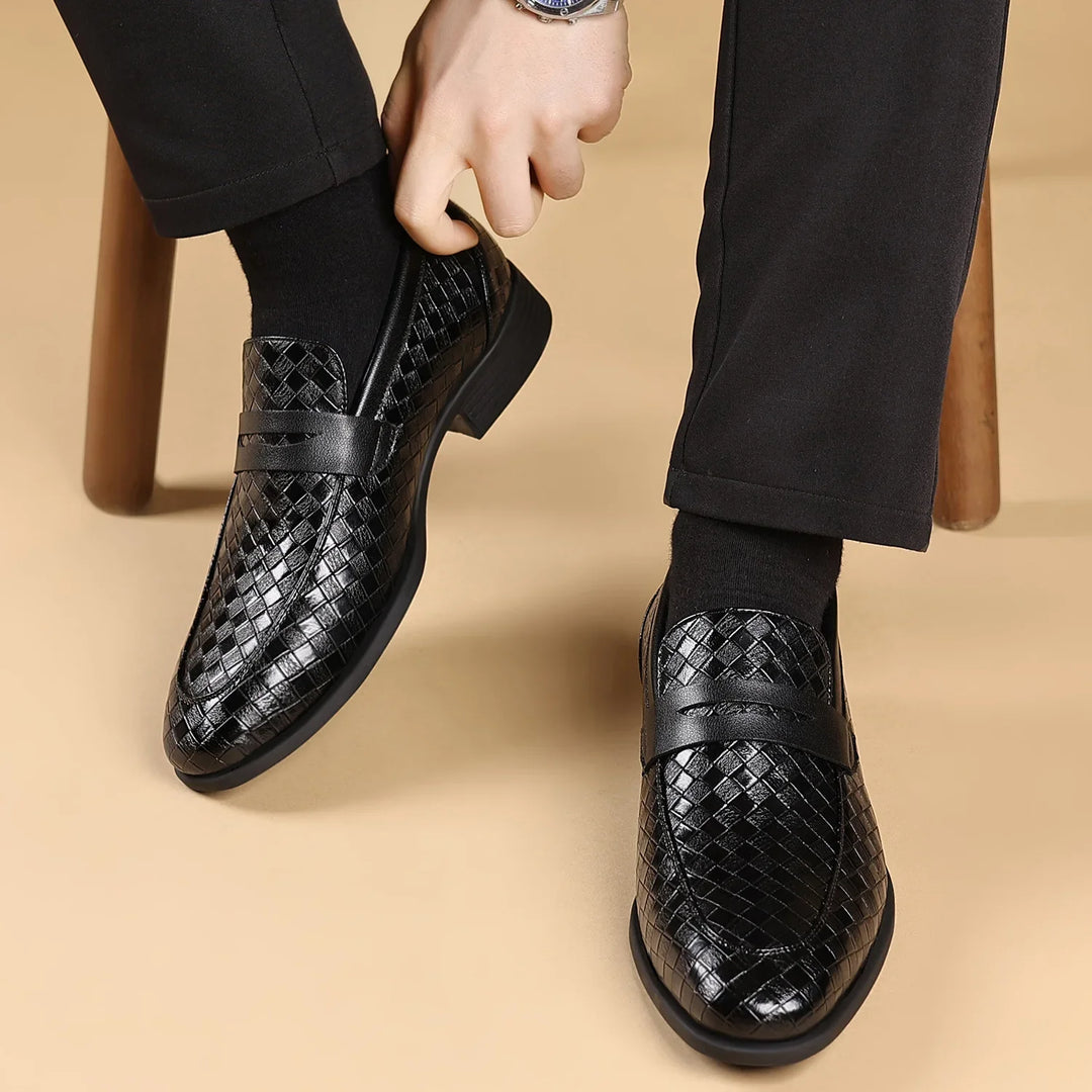 Detailed front view of men's dark brown woven leather penny loafers with penny slot