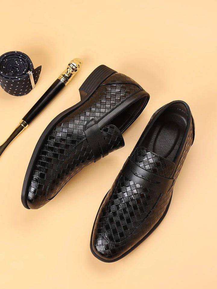 Angled view of men's black woven leather penny loafers, highlighting craftsmanship & comfort