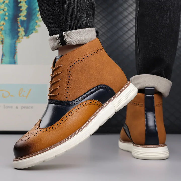Full-shot of men's brogue leather boots on a white background, showcasing their design.