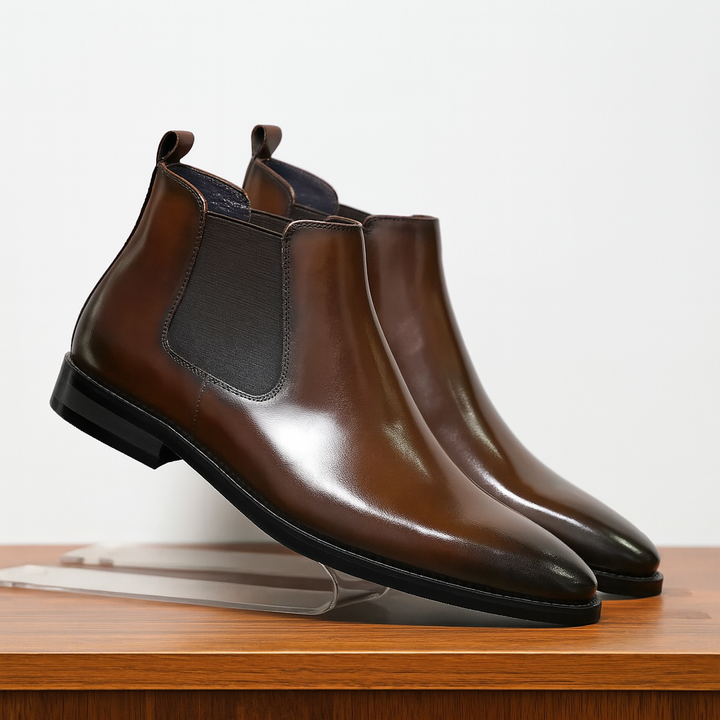 Men's classic brown leather Chelsea boots, slip-on style, perfect for dress or casual wear.