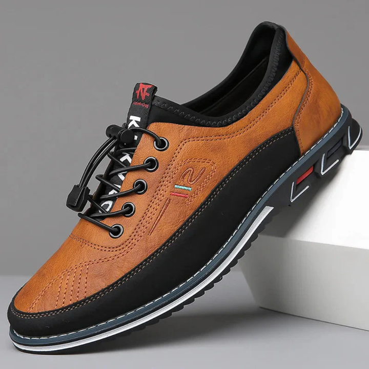 Men's classic brown leather Oxford dress shoes, perfect for formal occasions & business attire. Elegant lace-up design.