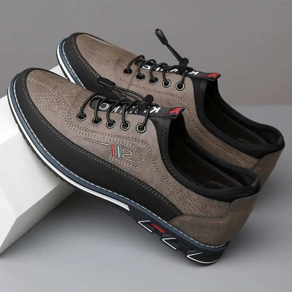Pair of men's sophisticated black Oxford dress shoes, showcasing classic lines & a comfortable design for business wear.