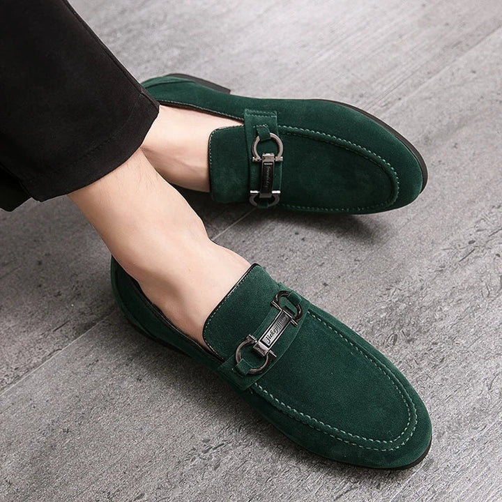 Stylish men's suede bit loafers in a rich tan color with a silver bit detail.