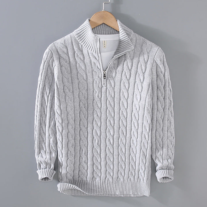 Front view of a men's versatile cable knit pullover sweater with a half-zip neckline, ideal for layering.