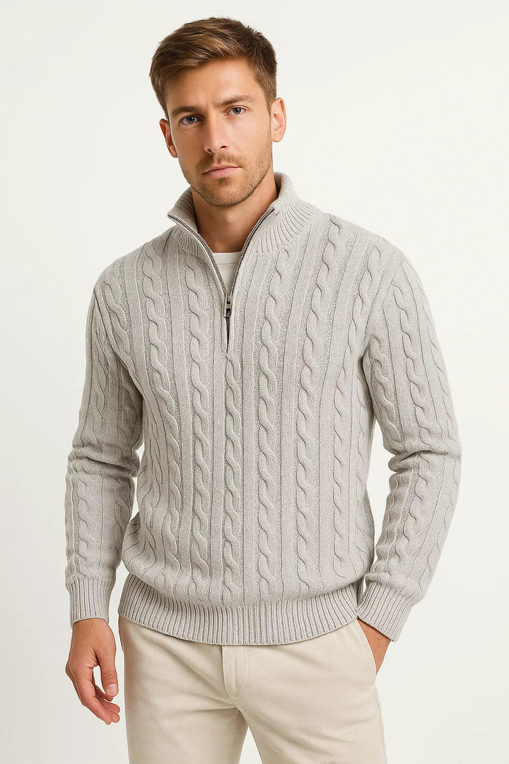 Close-up of a men's gray cable knit sweater with a functional zip neck, ideal for spring fashion.