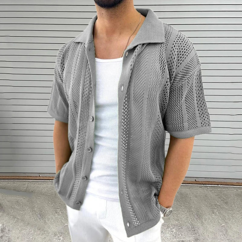 Short-sleeve men's knit shirt, classic collar, timeless summer style for a smart casual wardrobe.