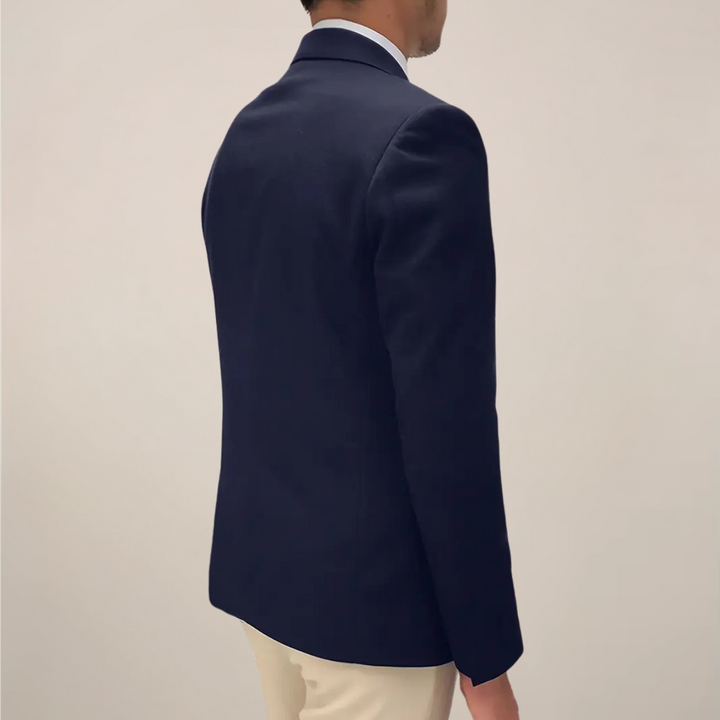Sophisticated men's dark blue blazer, featuring distinctive gold buttons & a sharp notch lapel. Great for business & formal.