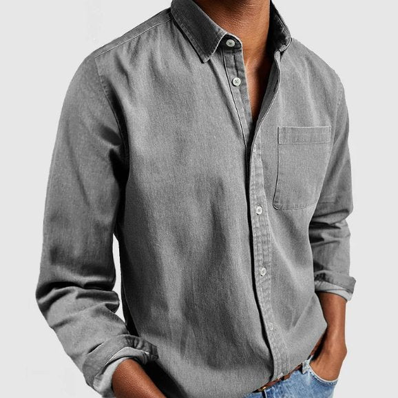 Effortless men's fashion: classic denim long sleeve button-down shirt for a stylish, casual look.