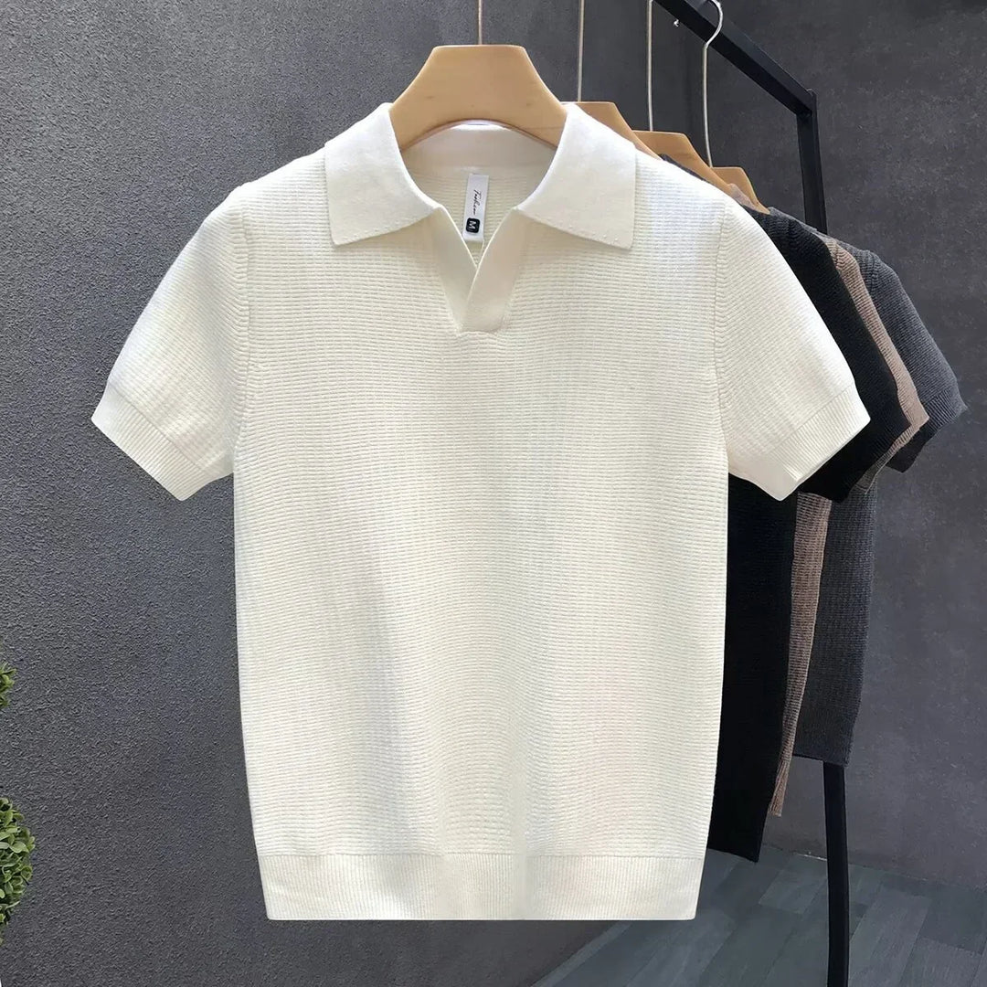 Close-up of a men's soft knit polo shirt, highlighting the breathable fabric and quality classic design.