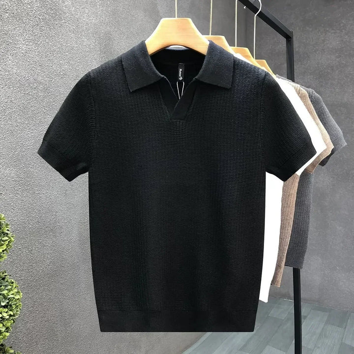 Man wearing a classic short sleeve knit polo shirt, ideal for casual or smart casual men's fashion.