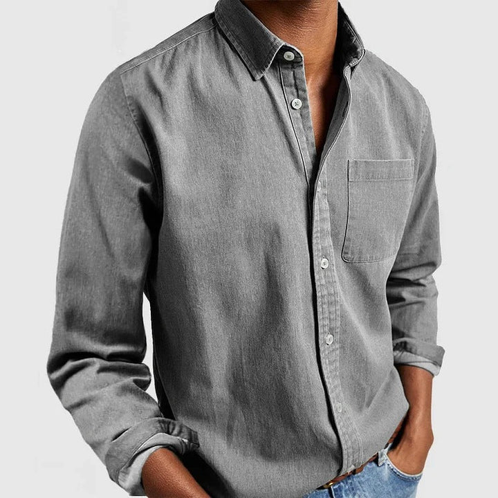 Classic fit men's long sleeve button-down shirt featuring a single chest pocket. Great for business casual.