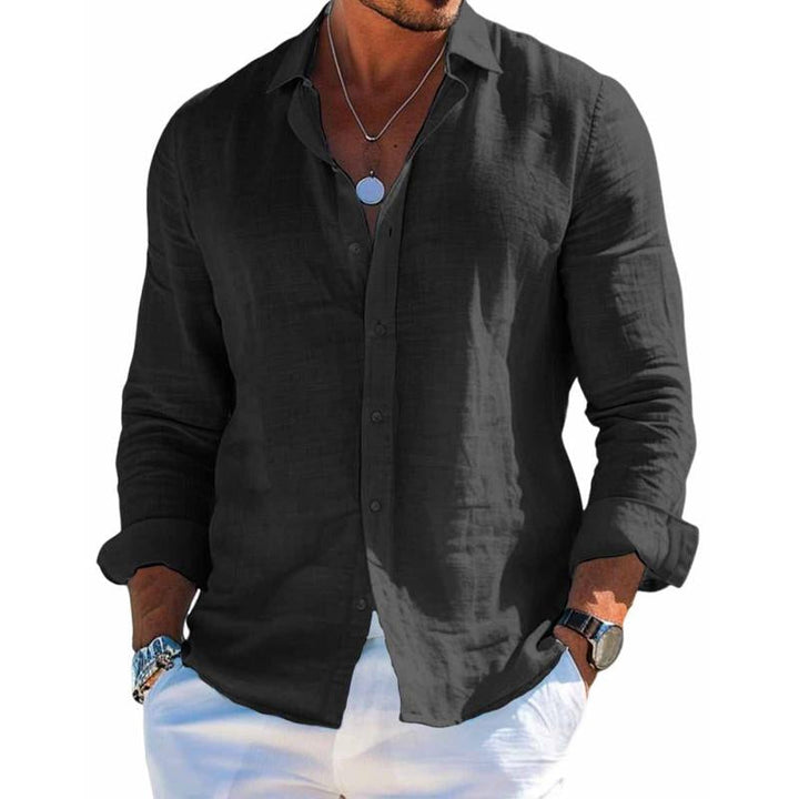 Man wearing a versatile long-sleeve button-down shirt, ideal for stylish summer casual outfits & warm weather comfort.