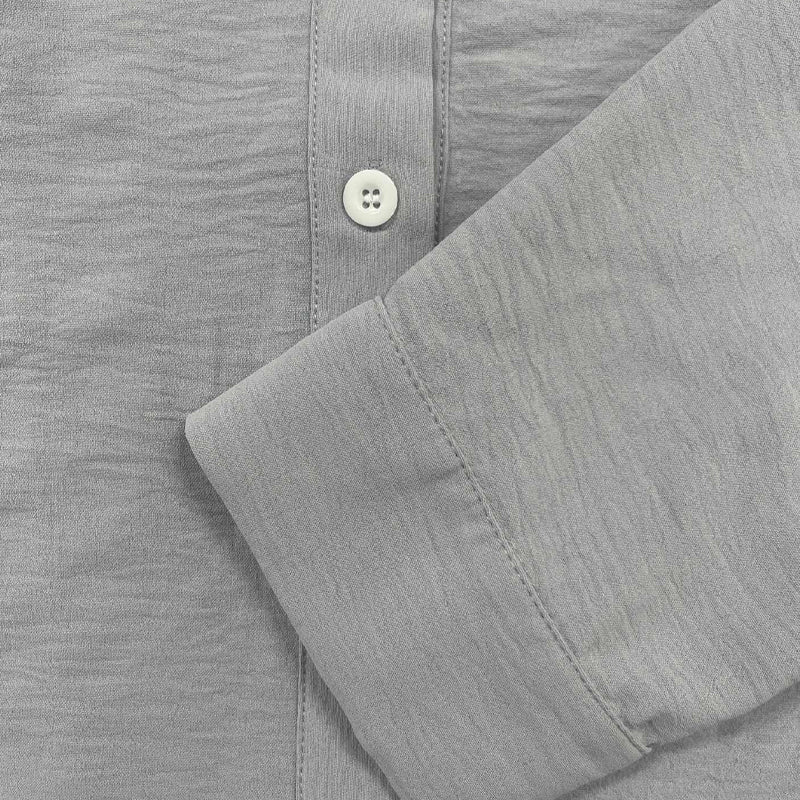 Close-up of a men's classic button-down shirt, highlighting the quality fabric & timeless design for summer fashion.