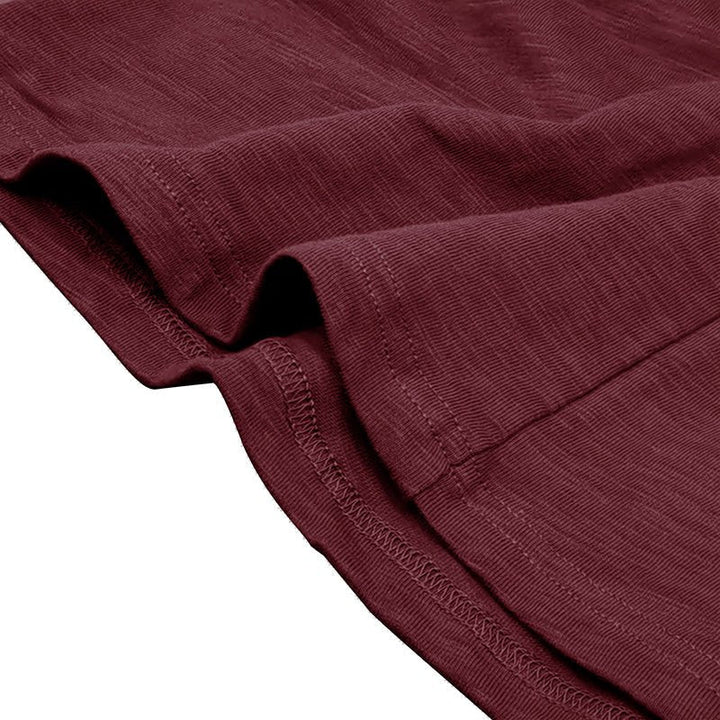 Model wearing a men's classic long-sleeve henley shirt with jeans.