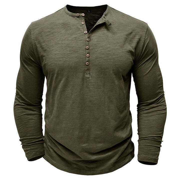 Men's versatile henley shirt in a deep forest green, suitable for outdoor activities.