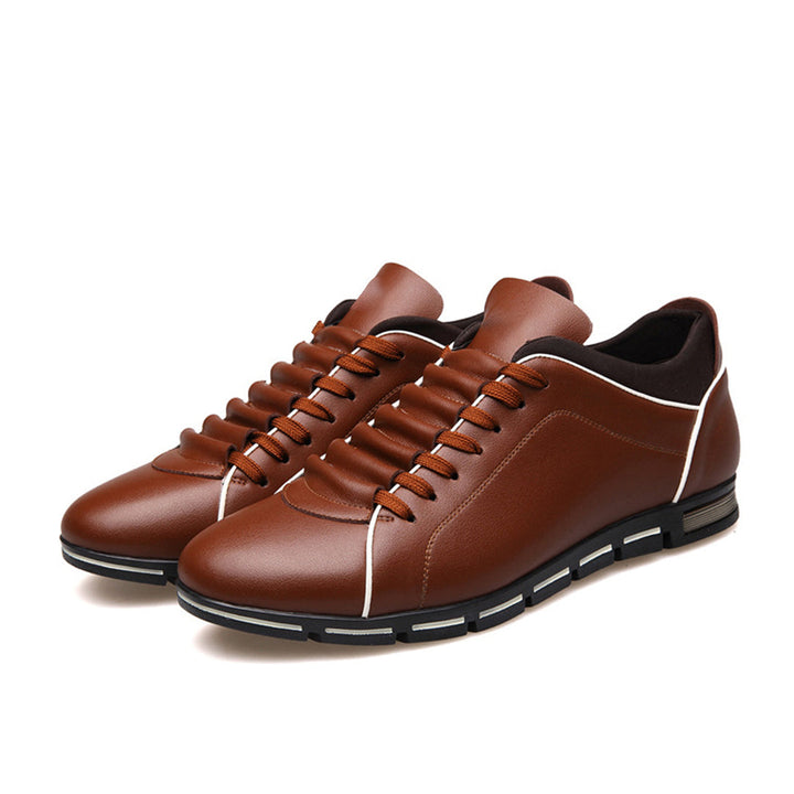 Clean men's classic low-top sneakers with laces, showcasing timeless casual fashion.
