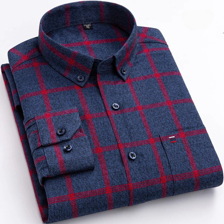 Man wearing a versatile men's long-sleeve plaid button-down shirt, suitable for semi-formal or casual looks.