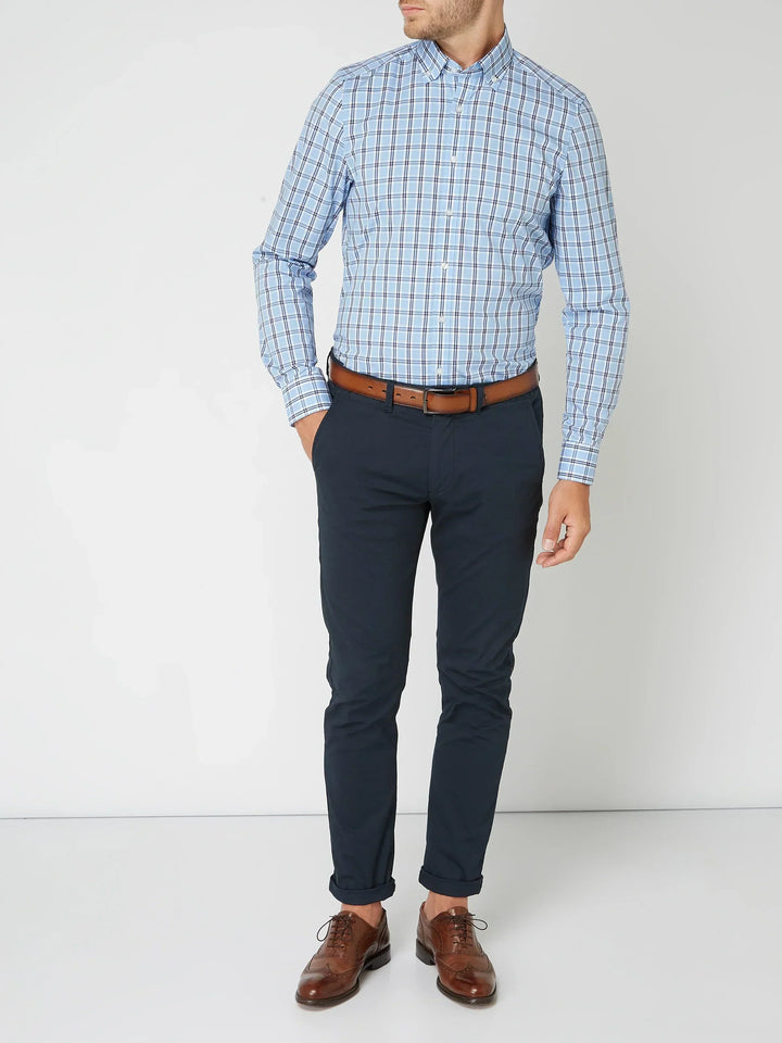 Model posing in a men's comfortable and fashionable checkered button-down shirt, ideal for everyday style.