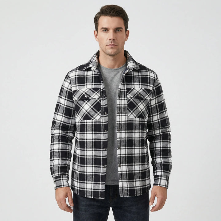 Heavy-duty men's plaid lumberjack jacket with soft quilted lining, ensuring warmth in winter.
