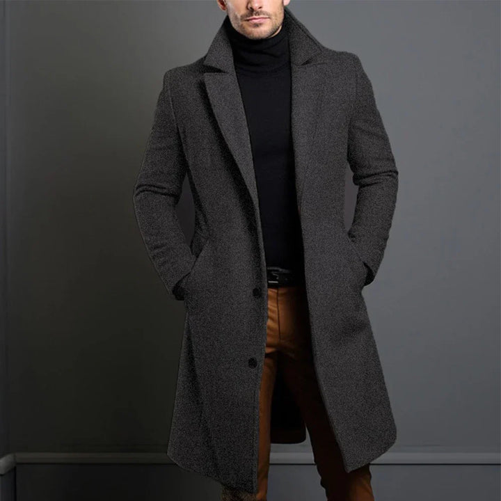 Elegant men's single-breasted trench coat style overcoat. Tailored outerwear for smart casual or formal business fashion.