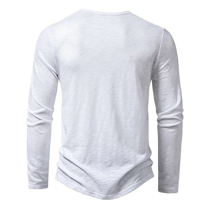 Streamlined men's slim fit henley, long sleeve, providing a sleek & modern casual silhouette.