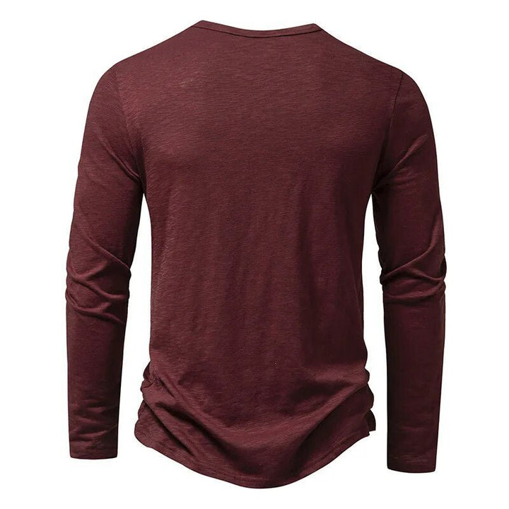 Casual men's slim fit long sleeve henley shirt, styled for relaxed everyday comfort.