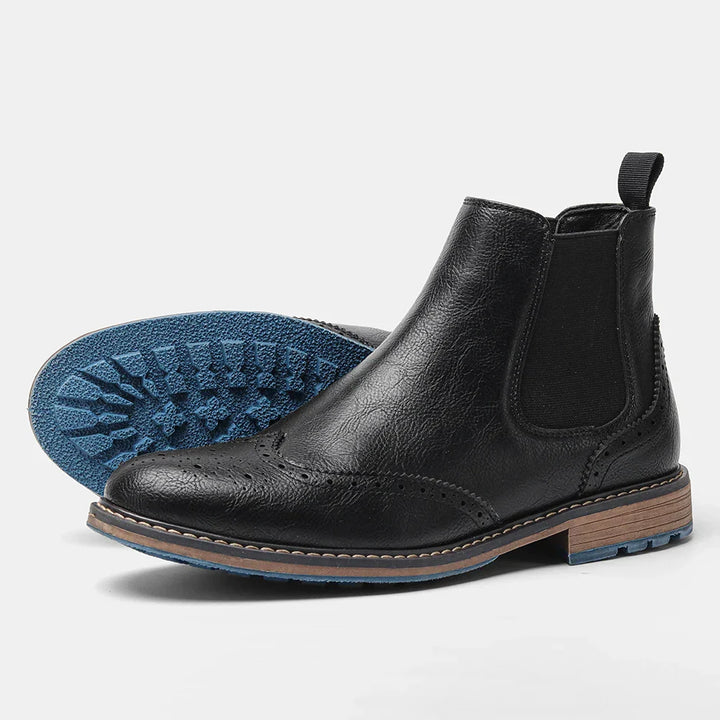 Mens Chelsea boots, close-up of premium leather texture and comfortable pull tab