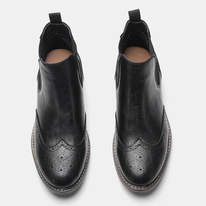 Mens black Chelsea boots, showcasing timeless footwear design and sturdy construction