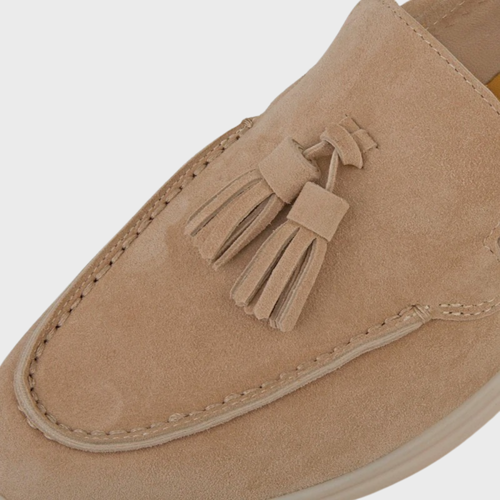 Close-up of the delicate tassels on a pair of Men's Classic Suede Loafers, highlighting craftsmanship.