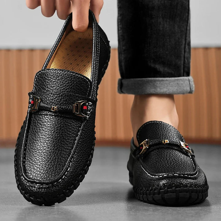 Stack of men's premium leather bit loafers in different sizes, ready for elegant dress shoe moments