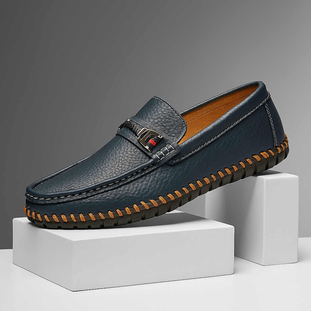 Close-up of men's black leather bit loafers with silver-tone hardware, luxurious and comfortable footwear