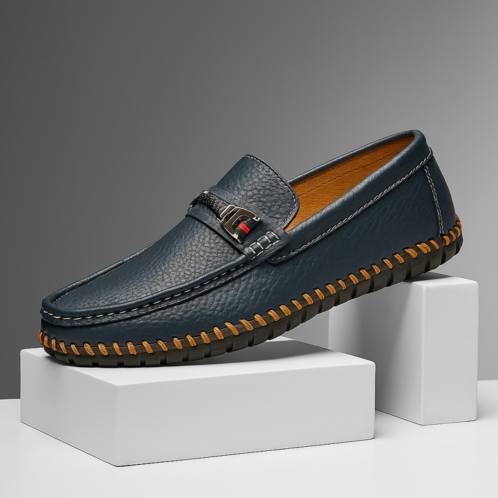 Close-up of men's black leather bit loafers with silver-tone hardware, luxurious and comfortable footwear