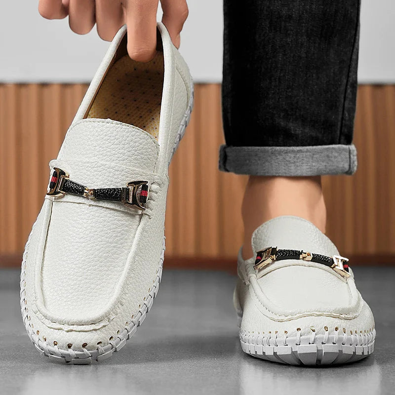 Studio shot of men's premium leather bit loafers on a white background, highlighting product features