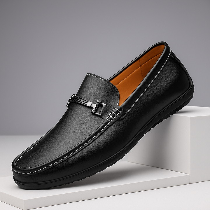 Close-up of the metal bit detail on men's black leather bit loafers
