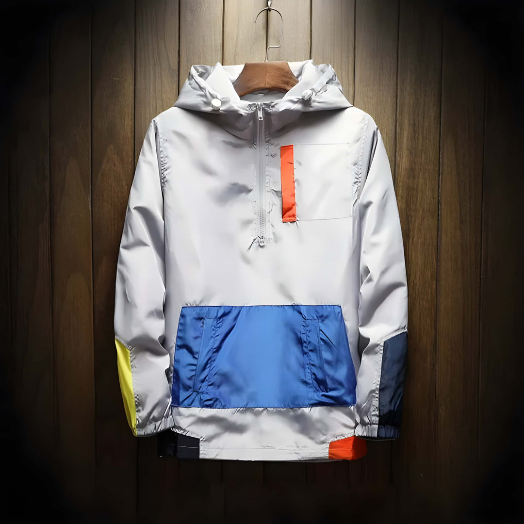 Men's color block hooded half-zip windbreaker jacket. Lightweight outerwear for casual or athletic wear.