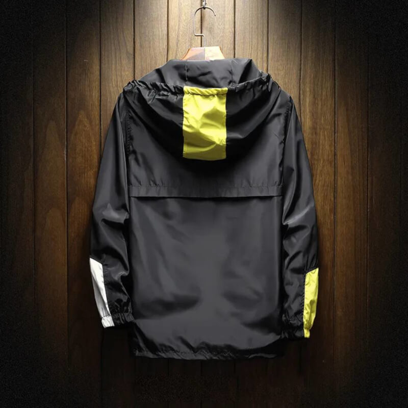 Lightweight men's color block hooded half-zip windbreaker. Perfect casual outerwear for comfortable outdoor activities.