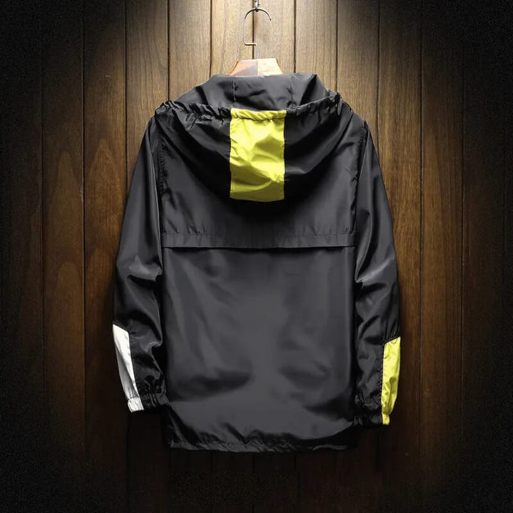 Lightweight men's color block hooded half-zip windbreaker. Perfect casual outerwear for comfortable outdoor activities.