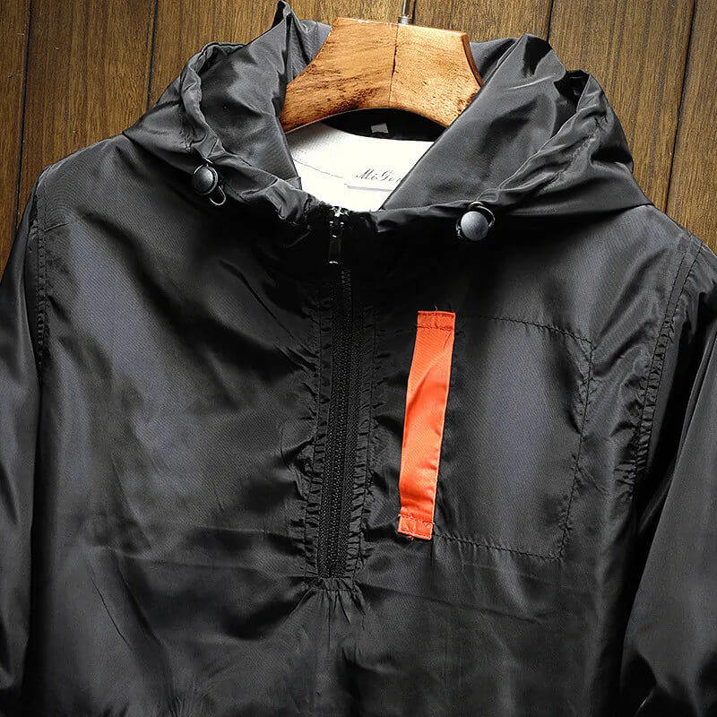 Stylish men's color block windbreaker jacket with hood & half-zip. Trendy menswear for active lifestyles.