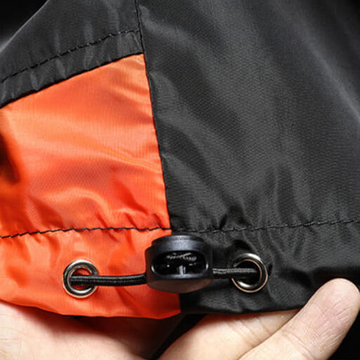 Men's athletic color block windbreaker jacket, hooded with half-zip. Provides lightweight protection for outdoor wear.