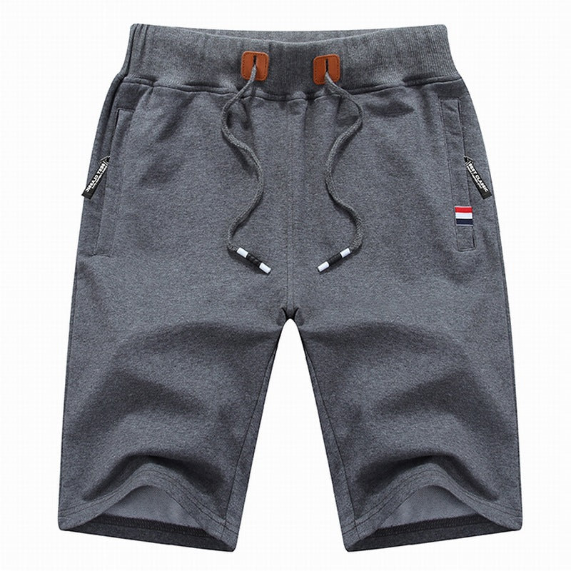 Men's relaxed fit summer shorts with adjustable drawstring and useful zipper pockets, great for travel.