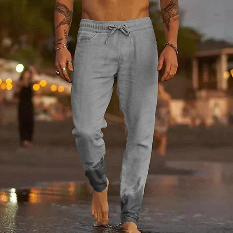 Stylish men's cuffed jogger pants with drawstring, perfect for casual wear & an active lifestyle. Comfortable summer trousers.