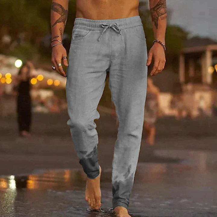 Stylish men's cuffed jogger pants with drawstring, perfect for casual wear & an active lifestyle. Comfortable summer trousers.