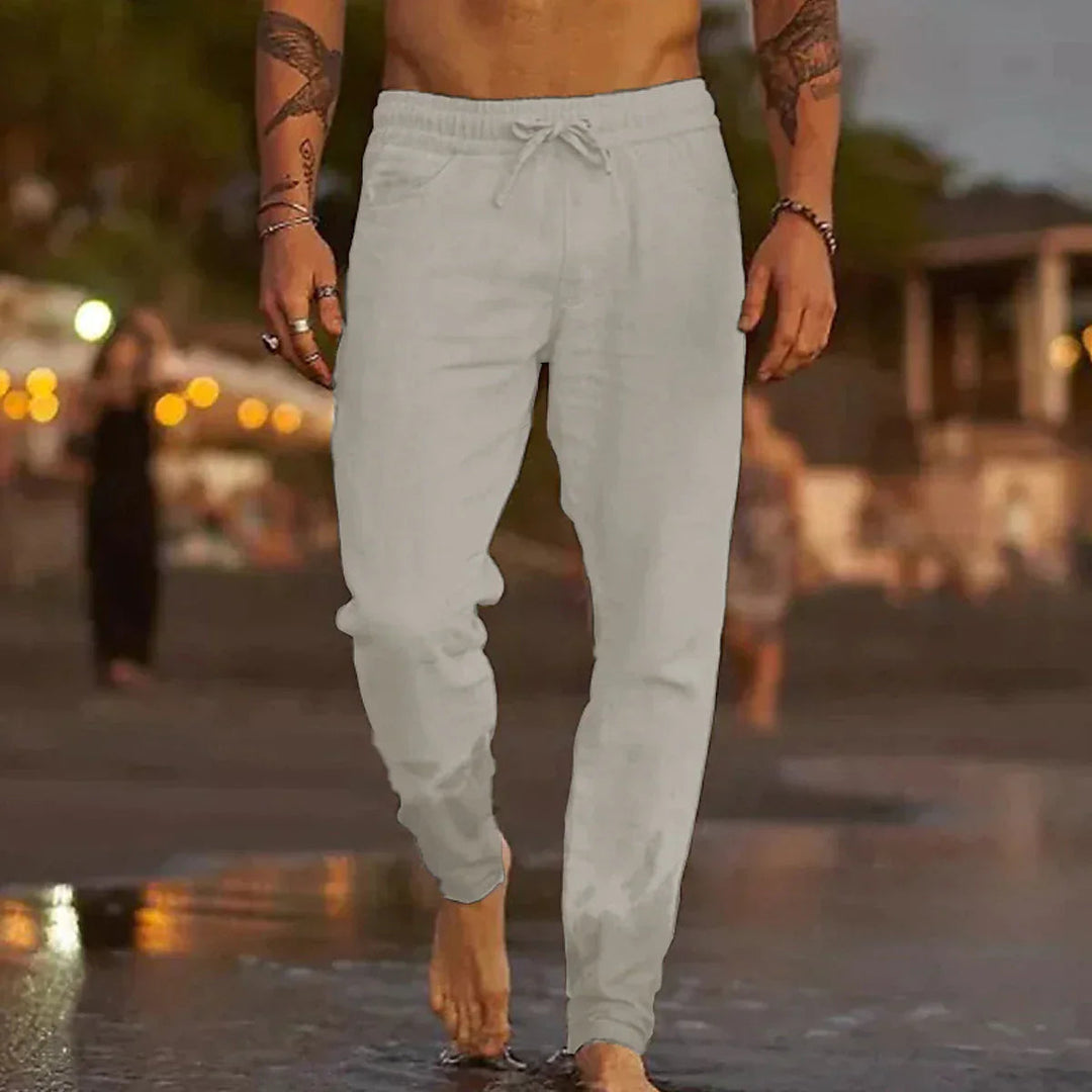 Versatile men's chino jogger pants with elastic drawstring waist. Comfortable athletic wear for casual or active fashion.